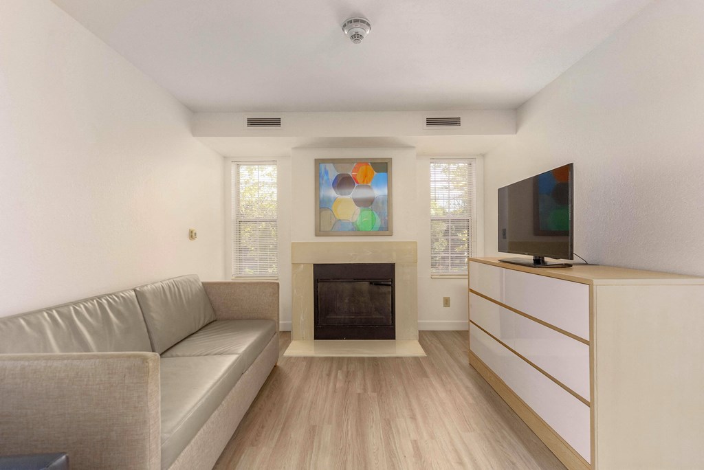 a living room with a couch and a fireplace